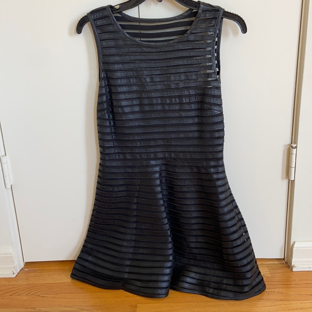 Unique edgy leather and mesh mini dress
